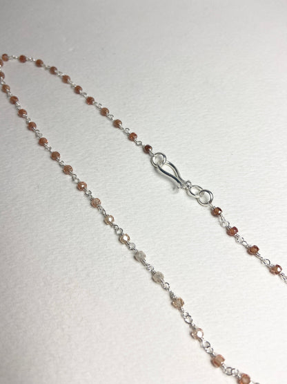Sterling silver necklace with faceted brown ombre zircon beads and a hook clasp.