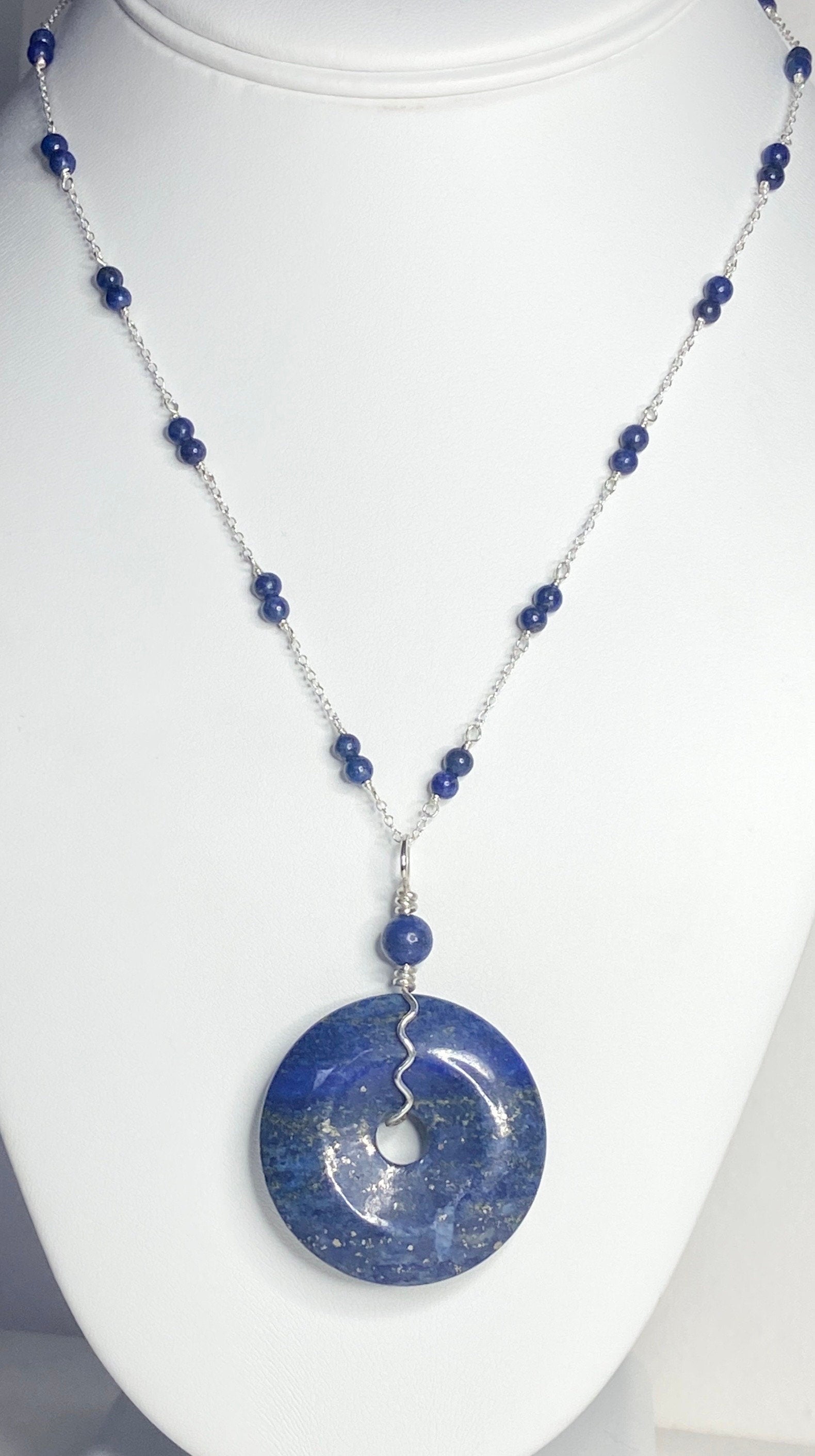 Lapis lazuli donut pendant necklace with sterling silver chain and beads.
