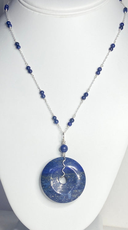 Lapis lazuli donut pendant necklace with sterling silver chain and beads.