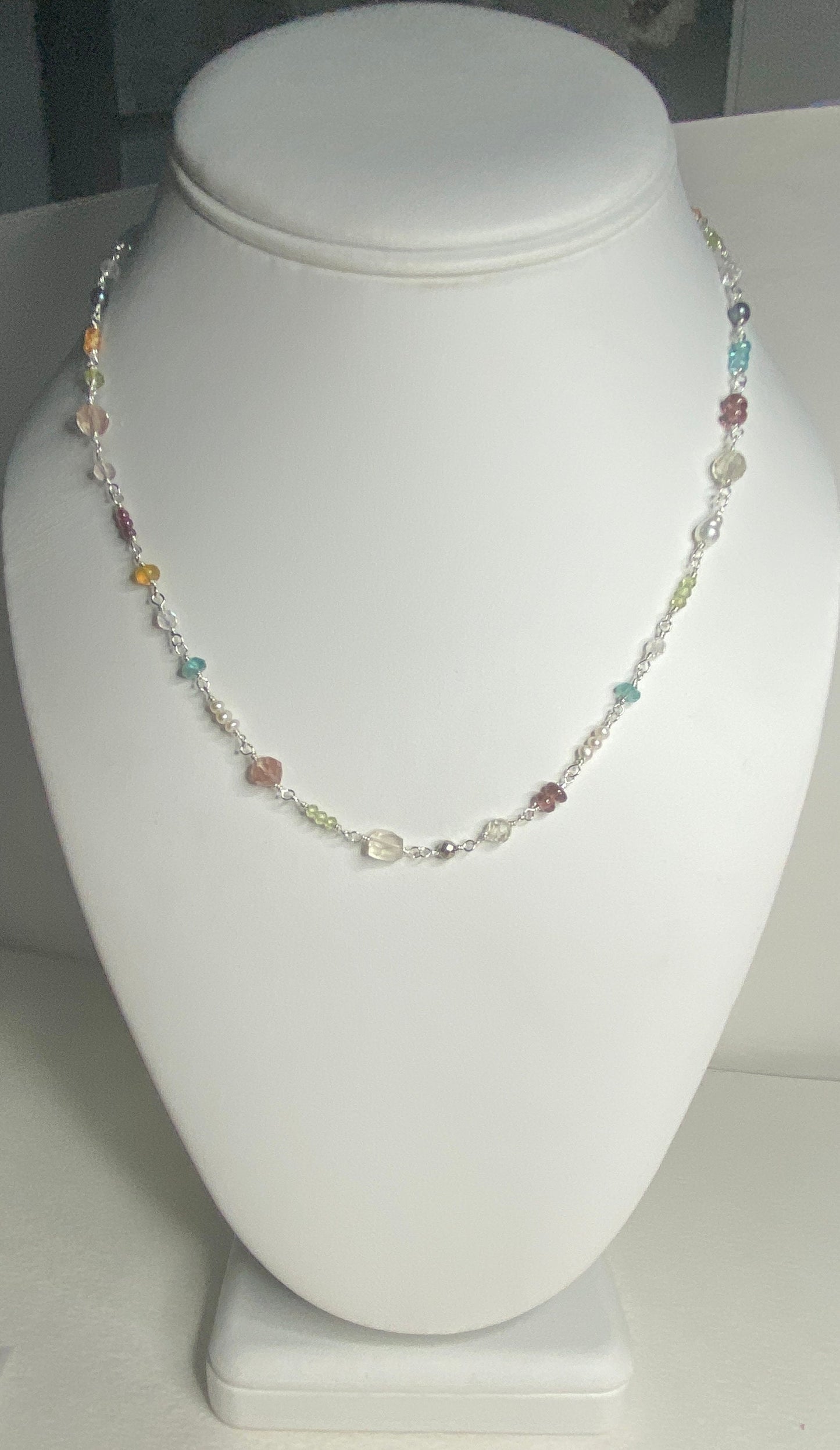 Sterling silver necklace with multi-colored natural gemstones.