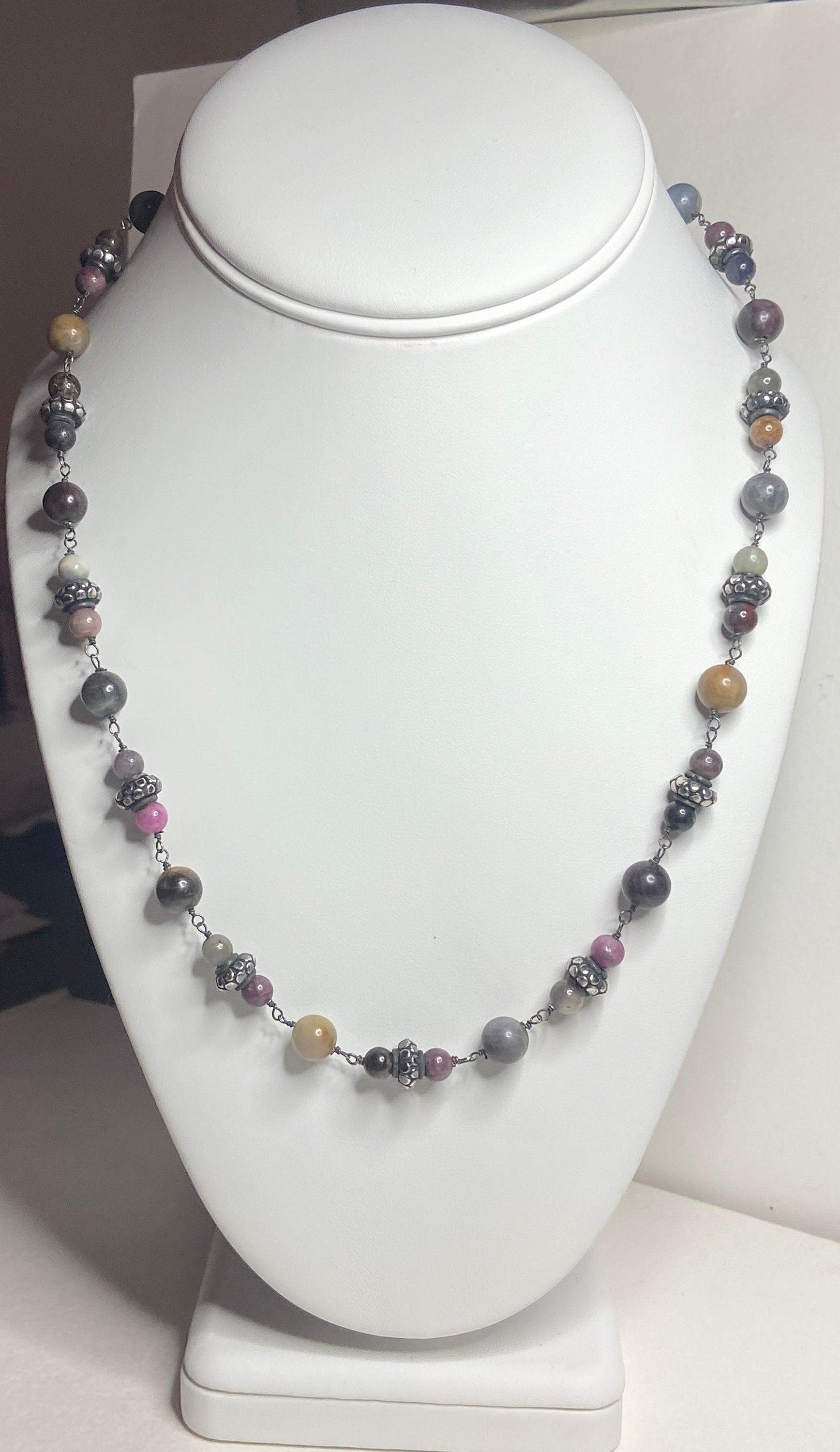Natural multi-color sapphire corundum beaded necklace with sterling silver accents.