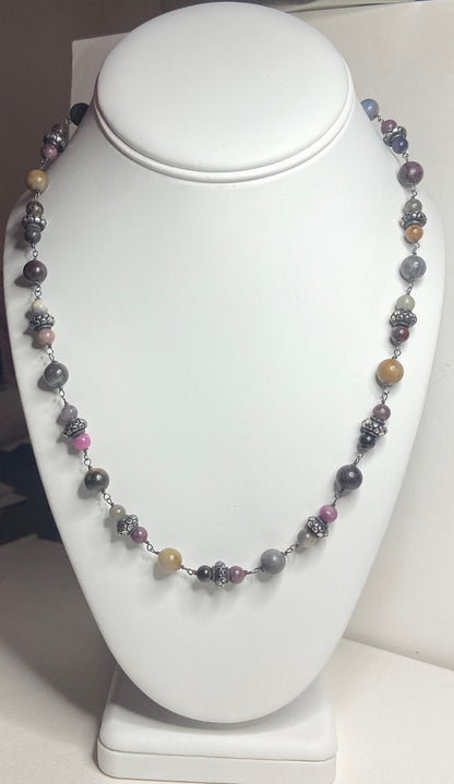 Natural multi-color sapphire corundum beaded necklace with sterling silver accents.