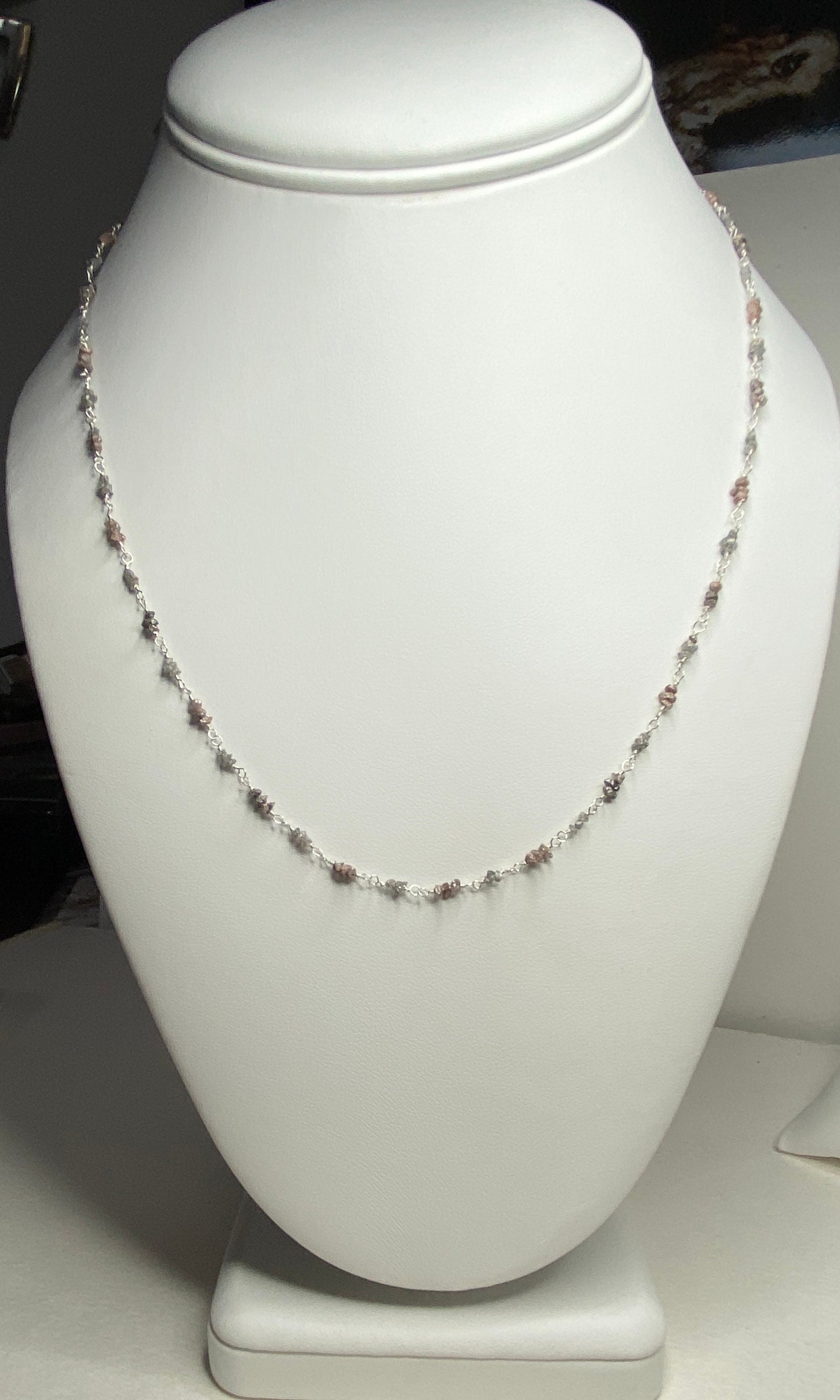 Sterling silver necklace with alternating rough natural silver and brown diamond beads.