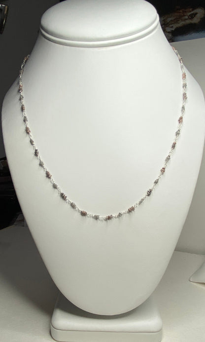 Sterling silver necklace with alternating rough natural silver and brown diamond beads.