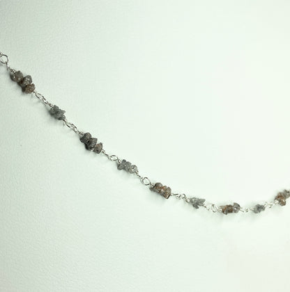 Sterling silver necklace with stations of rough natural silver and brown diamonds.