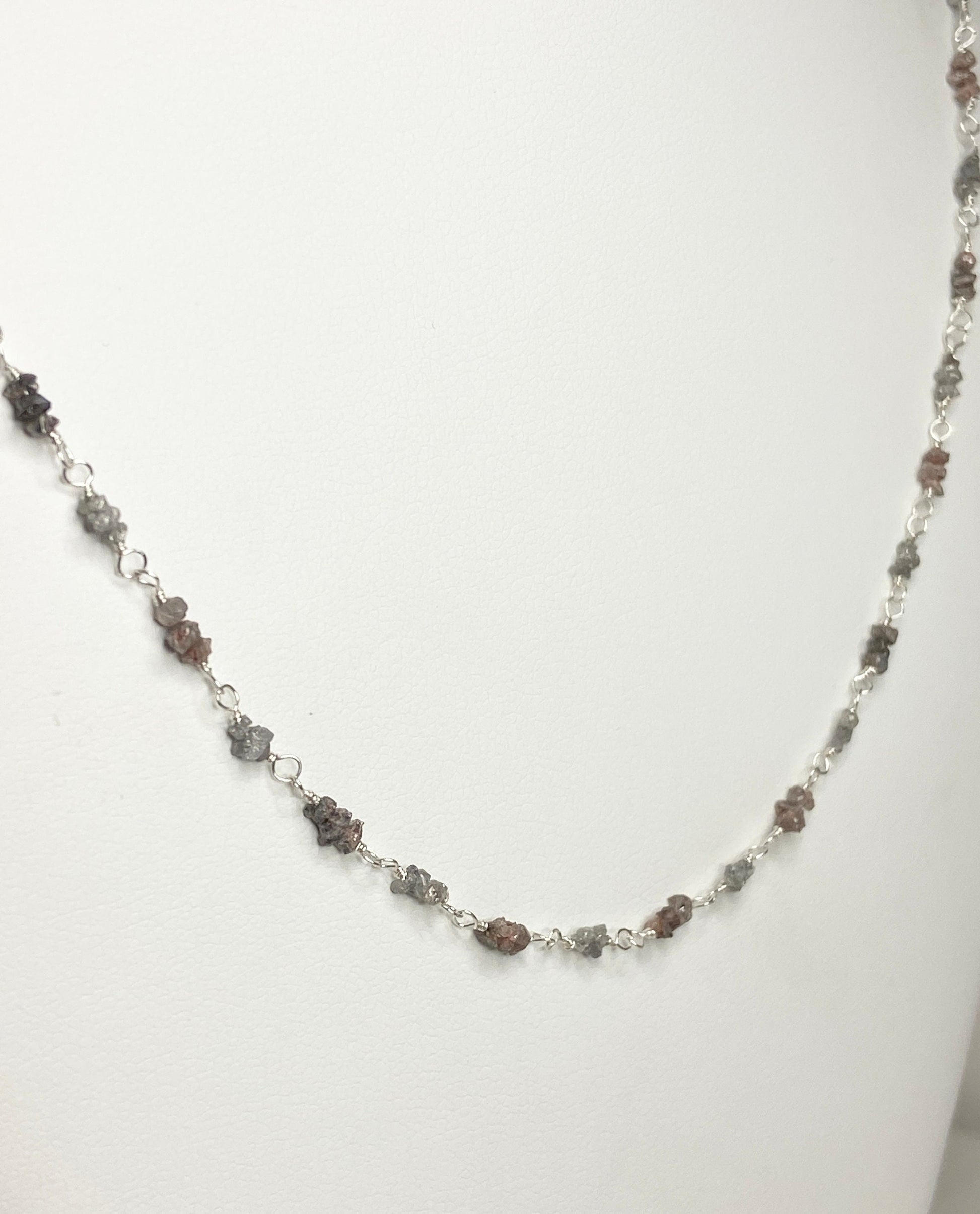 Sterling silver necklace with alternating rough natural silver and brown diamonds.