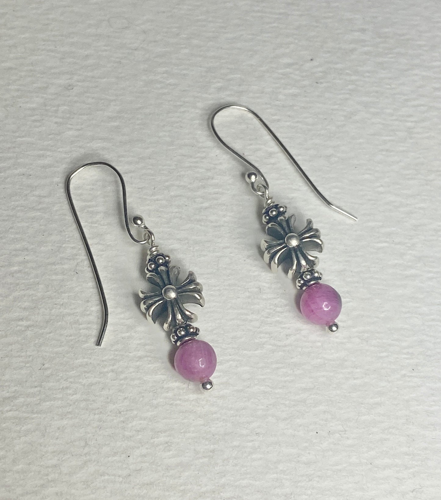 Sterling silver dangle earrings with pink sapphire beads and cross charms.