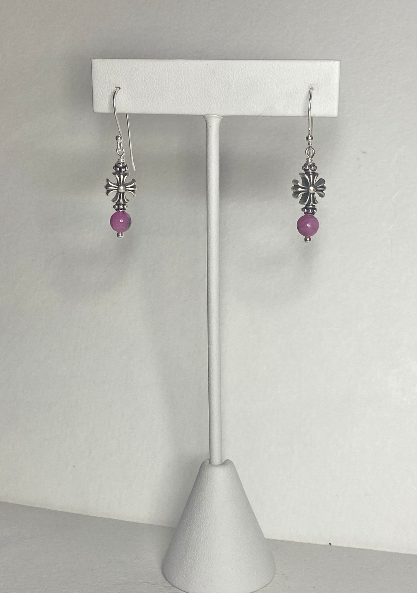 Sterling silver dangle earrings with pink sapphire beads and cross charms.