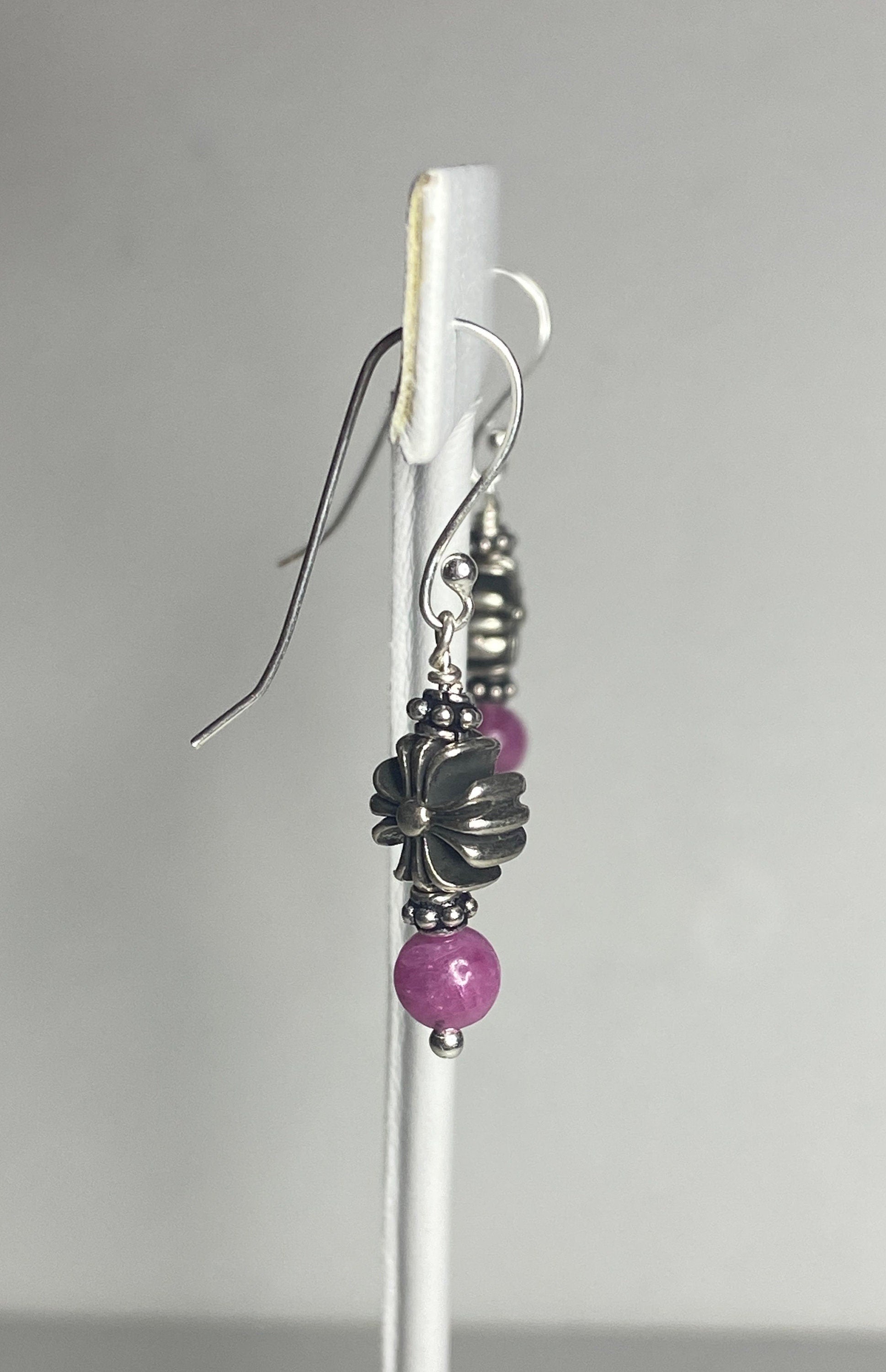 Sterling silver dangle earrings with pink sapphire beads and a cross charm.