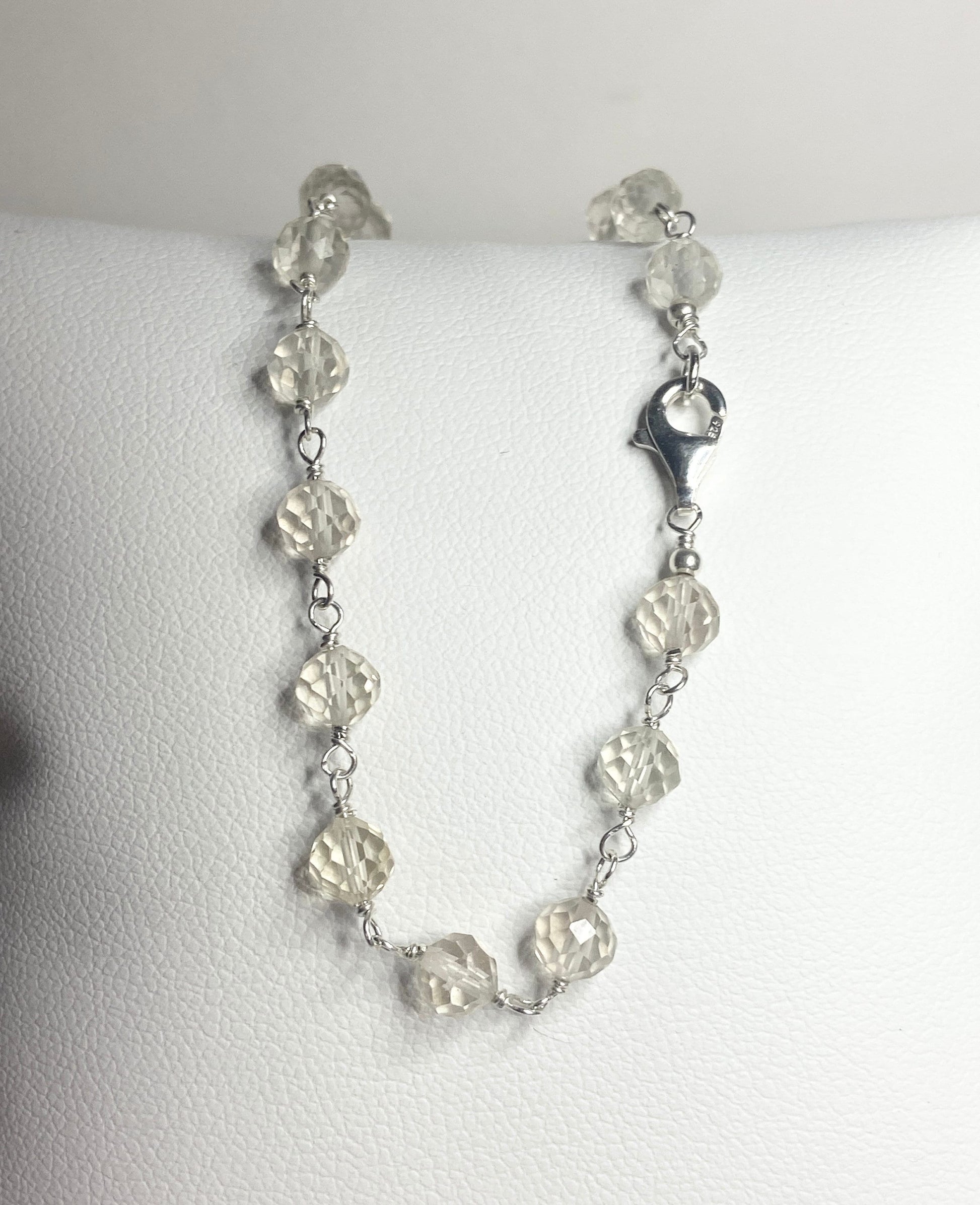 A sterling silver bracelet with faceted yellow Oregon sunstone beads.