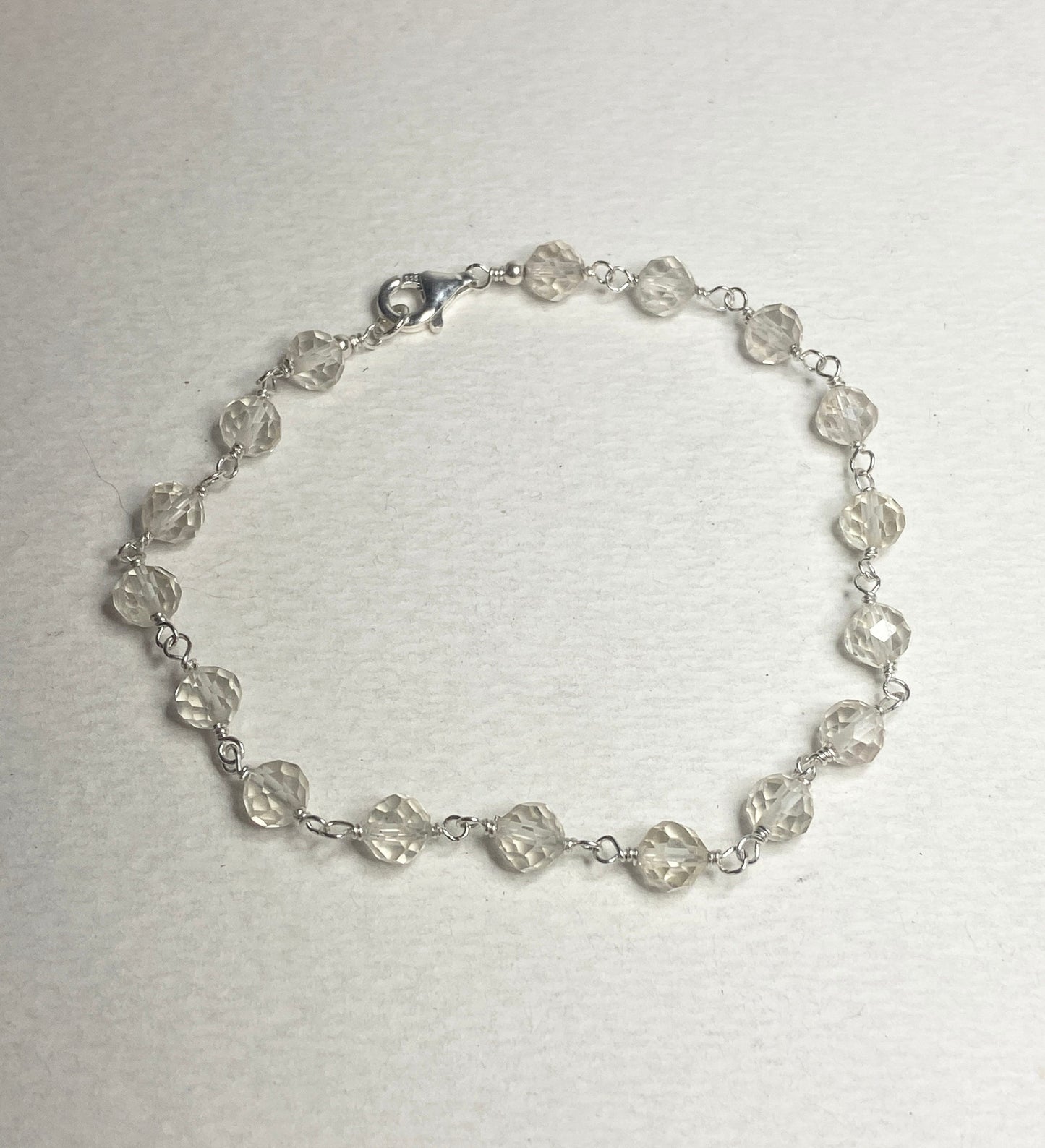 Sterling silver bracelet with faceted yellow Oregon sunstone beads.