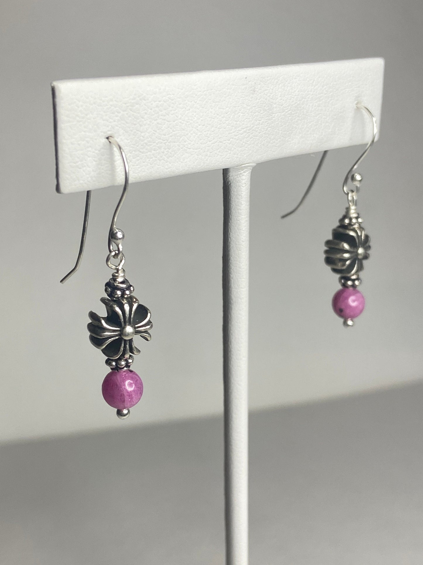 Sterling silver dangle earrings with pink sapphire corundum beads and cross charms.