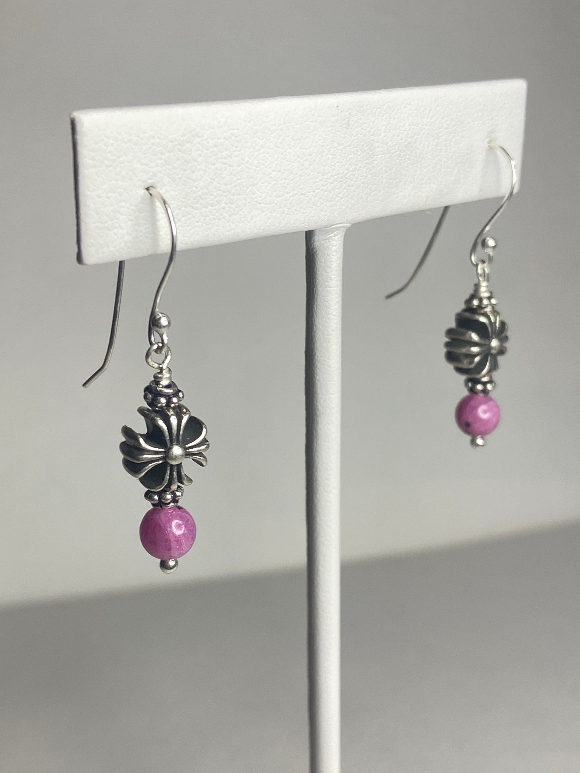 Sterling silver dangle earrings with pink sapphire corundum beads and cross charms.