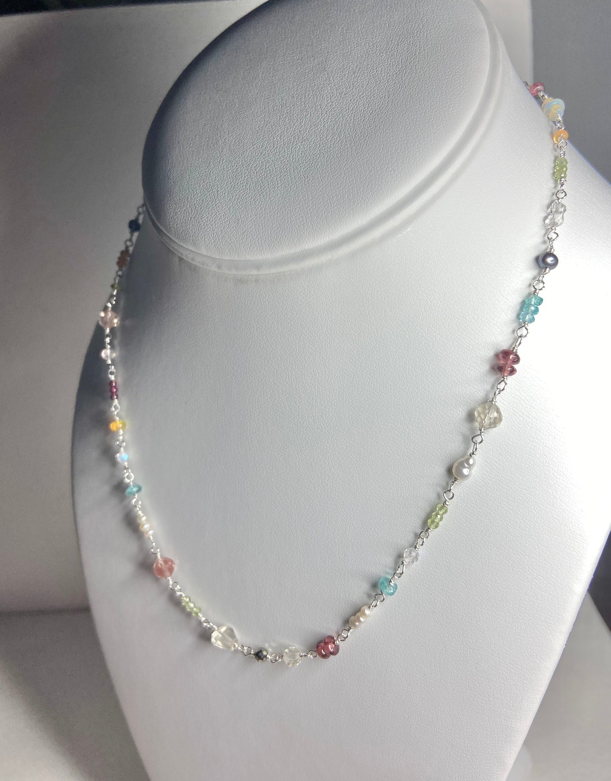 Sterling silver necklace with colorful natural gemstones and pearls.