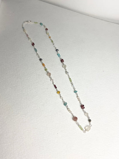 Sterling silver necklace with a variety of colorful natural gemstones.