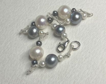 Sterling silver bracelet with Akoya, Tahitian, and freshwater pearls in black and white.
