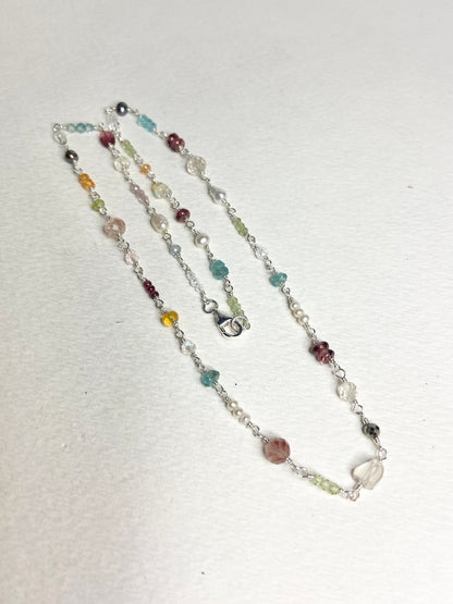 Sterling silver necklace with a variety of colorful natural gemstones and pearls.