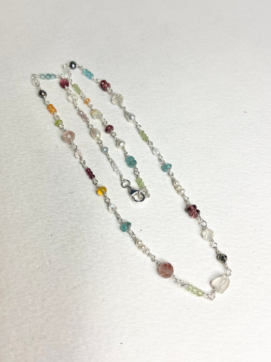 Sterling silver necklace with a variety of colorful natural gemstones and pearls.
