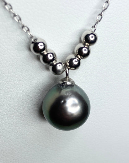 Sterling silver necklace with a Tahitian pearl pendant and floating beads.