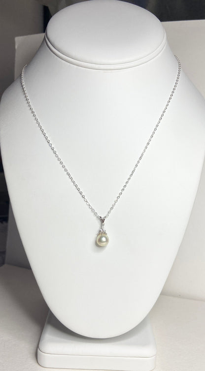 Sterling silver necklace with a tear-shaped Akoya pearl and crystal accents.