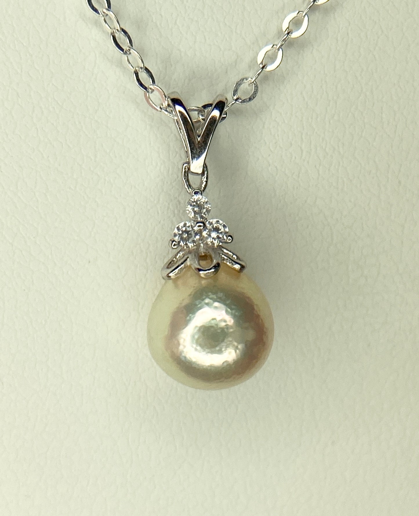 Sterling silver necklace with an out-of-round Akoya pearl and crystal accents.
