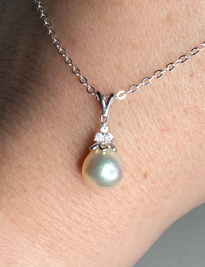 Sterling silver pendant necklace with an out-of-round Akoya pearl and crystal accents.