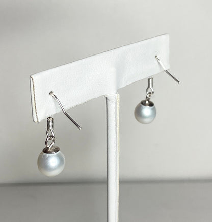 Sterling silver dangle earrings with 8mm white cultured pearls.