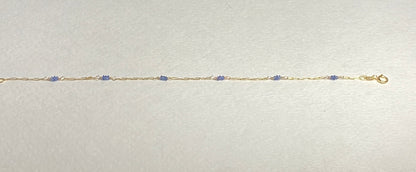 14k gold paperclip chain bracelet with untreated violet-blue Burmese sapphire beads.