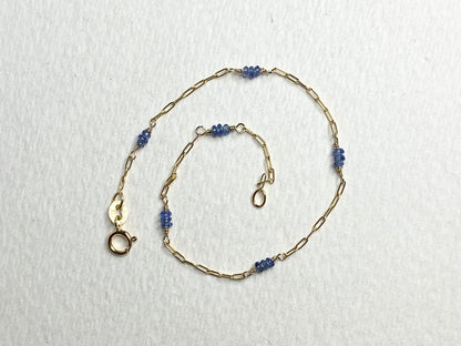 14k gold paperclip chain bracelet with untreated violet-blue Burmese sapphire beads.
