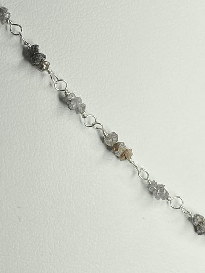 Sterling silver necklace with stations of rough natural silver and brown diamonds.