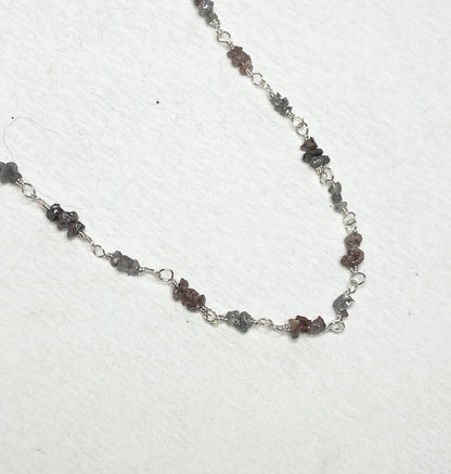 Sterling silver necklace with stations of rough natural silver and brown diamonds.