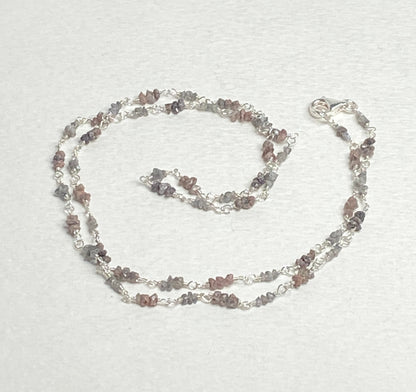 Sterling silver necklace with stations of rough natural silver and brown diamonds.