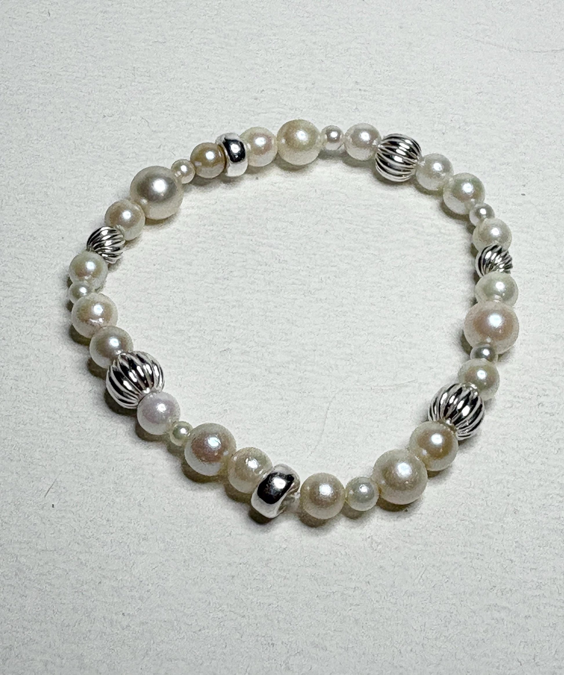 Vintage Akoya pearl stretch bracelet with sterling silver accents.