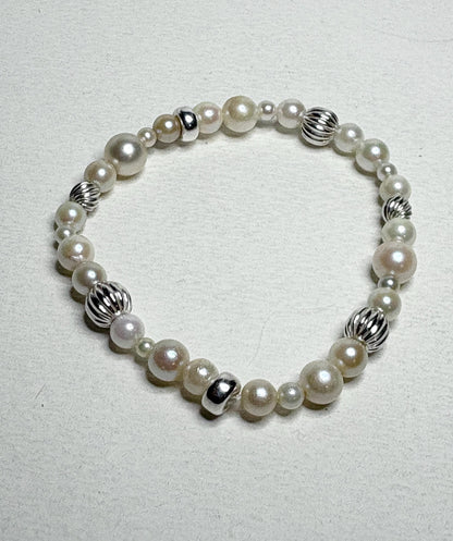 Vintage Akoya pearl stretch bracelet with sterling silver accents.