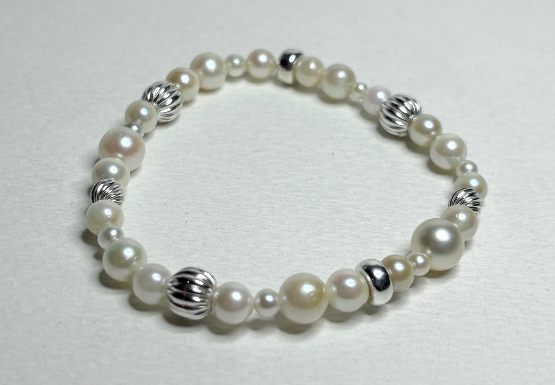 Vintage Akoya pearl stretch bracelet with sterling silver accents.