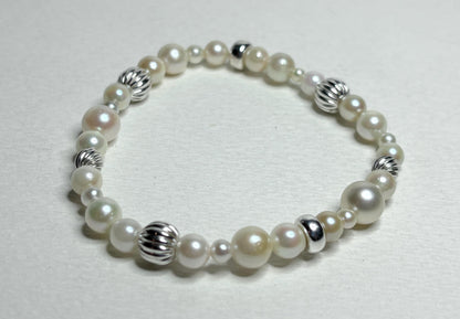 Vintage Akoya pearl stretch bracelet with sterling silver accents.