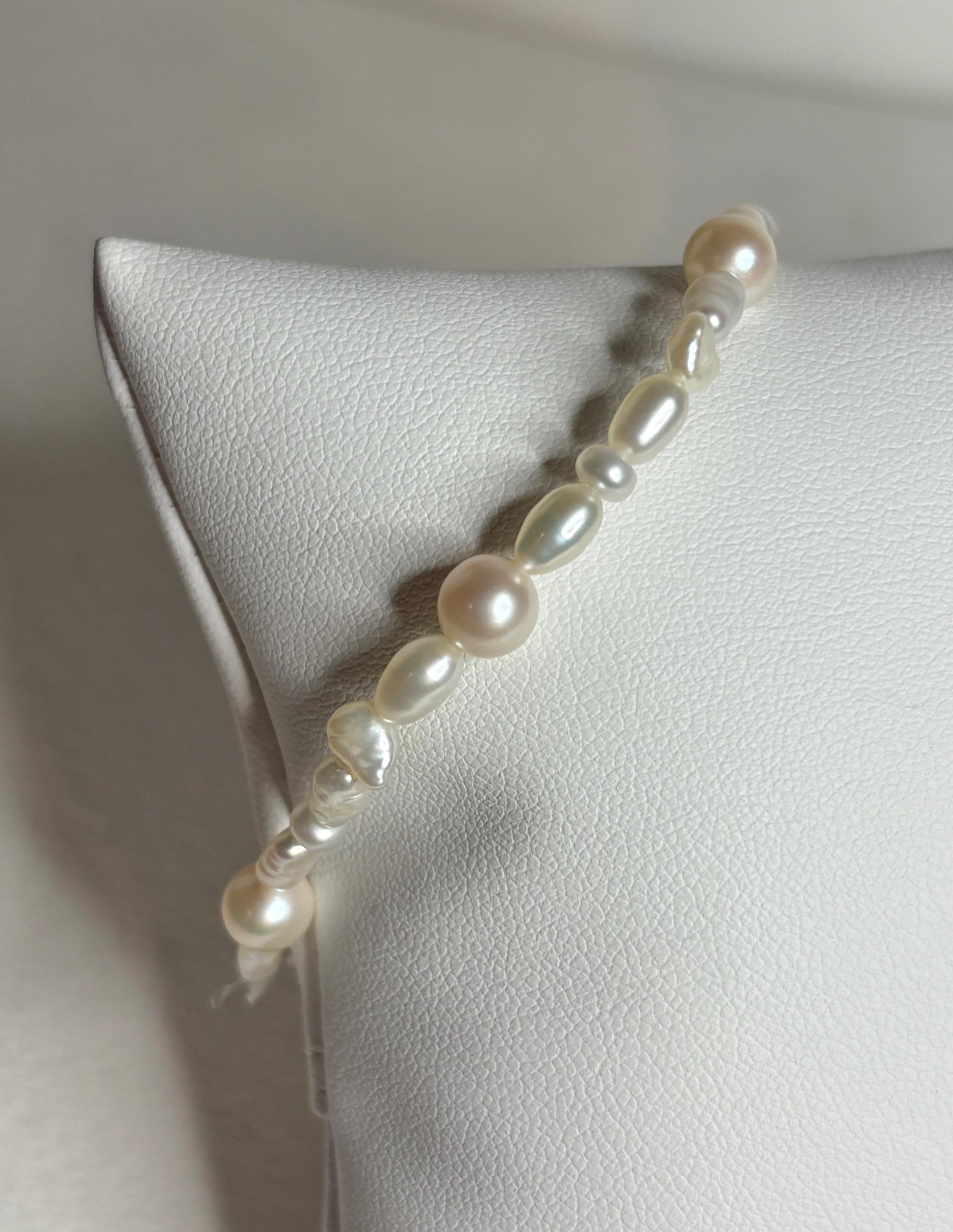 Freshwater cultured pearl rice and baroque stretch bracelet.