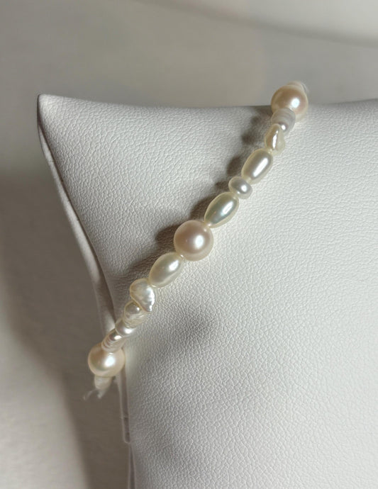 Freshwater cultured pearl rice and baroque stretch bracelet.