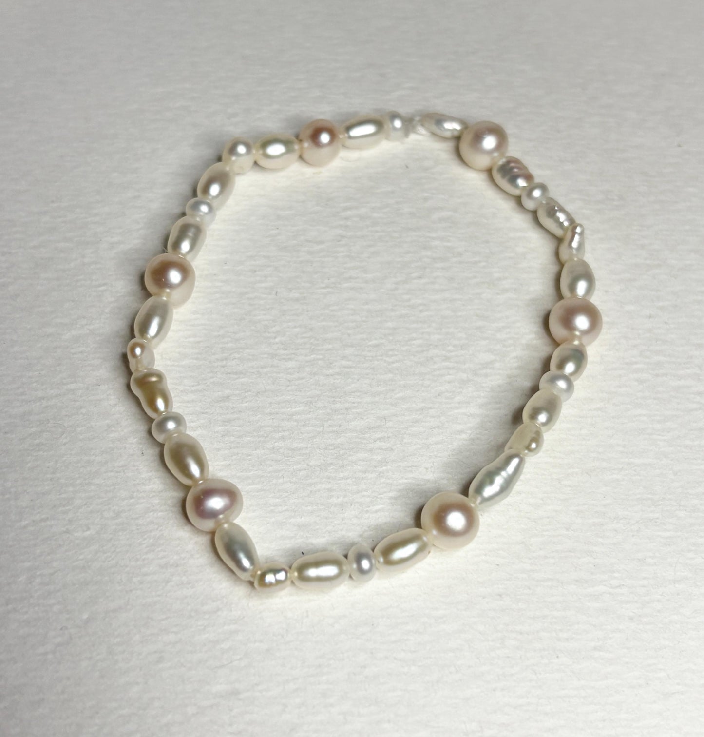 Freshwater cultured pearl rice and baroque stretch bracelet.