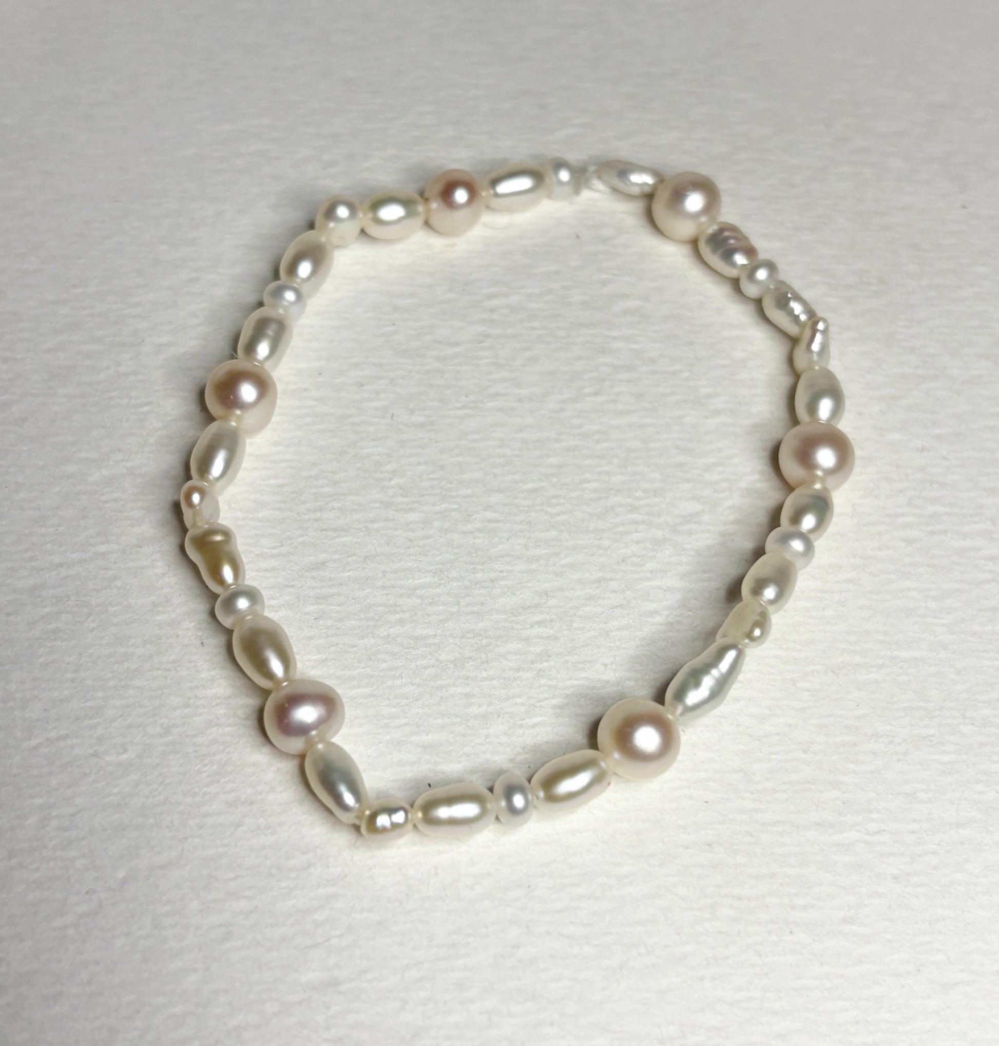 Freshwater cultured pearl rice and baroque stretch bracelet.