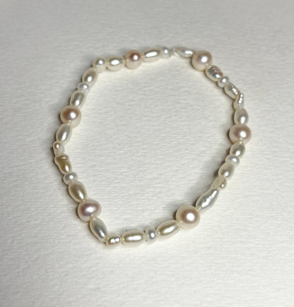 Freshwater cultured pearl rice and baroque stretch bracelet.