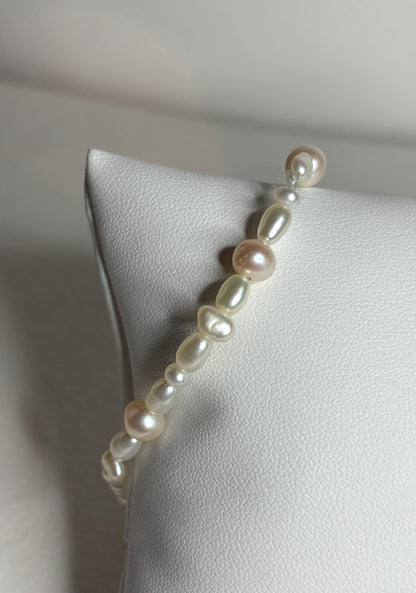 Freshwater cultured pearl rice and baroque stretch bracelet.