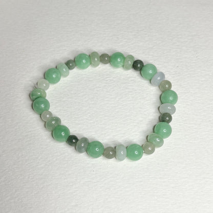 Burmese jadeite jade stretch bracelet with mixed green beads.