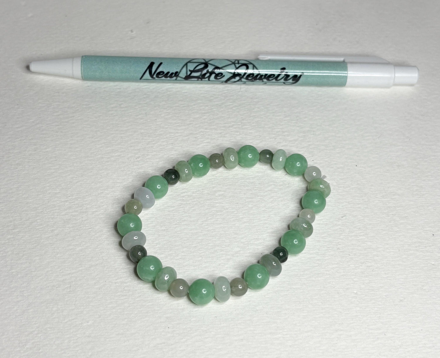 Burmese jadeite jade stretch bracelet with mixed green beads.