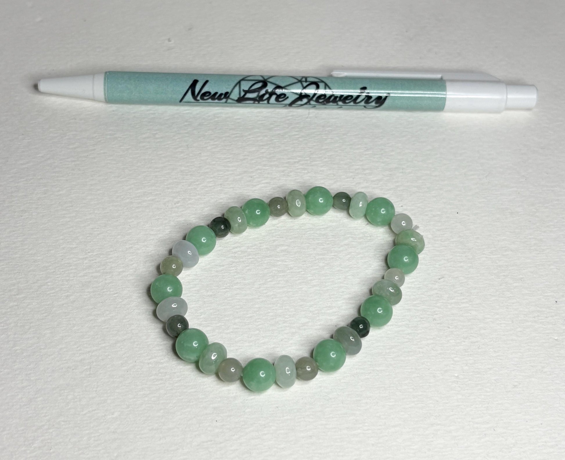 Burmese jadeite jade stretch bracelet with mixed green beads.