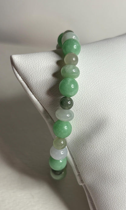 Burmese jadeite jade stretch bracelet with mixed green beads.