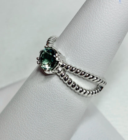 Sterling silver ring with a greenish Oregon sunstone and rope design.