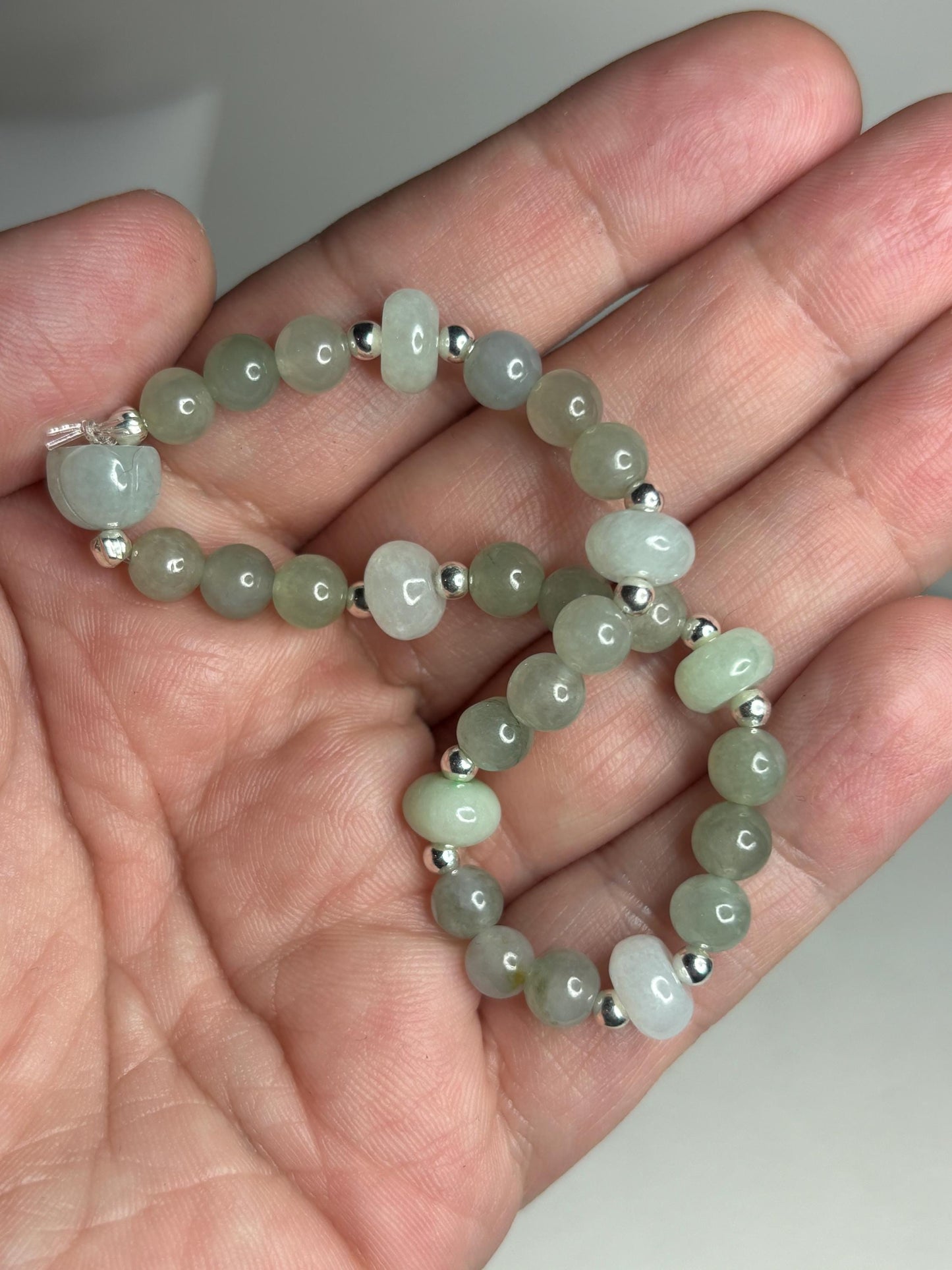 Natural Type A Icy Burmese Jadeite Jade Sterling Silver Stretch Bracelet with round and lotus bud beads.