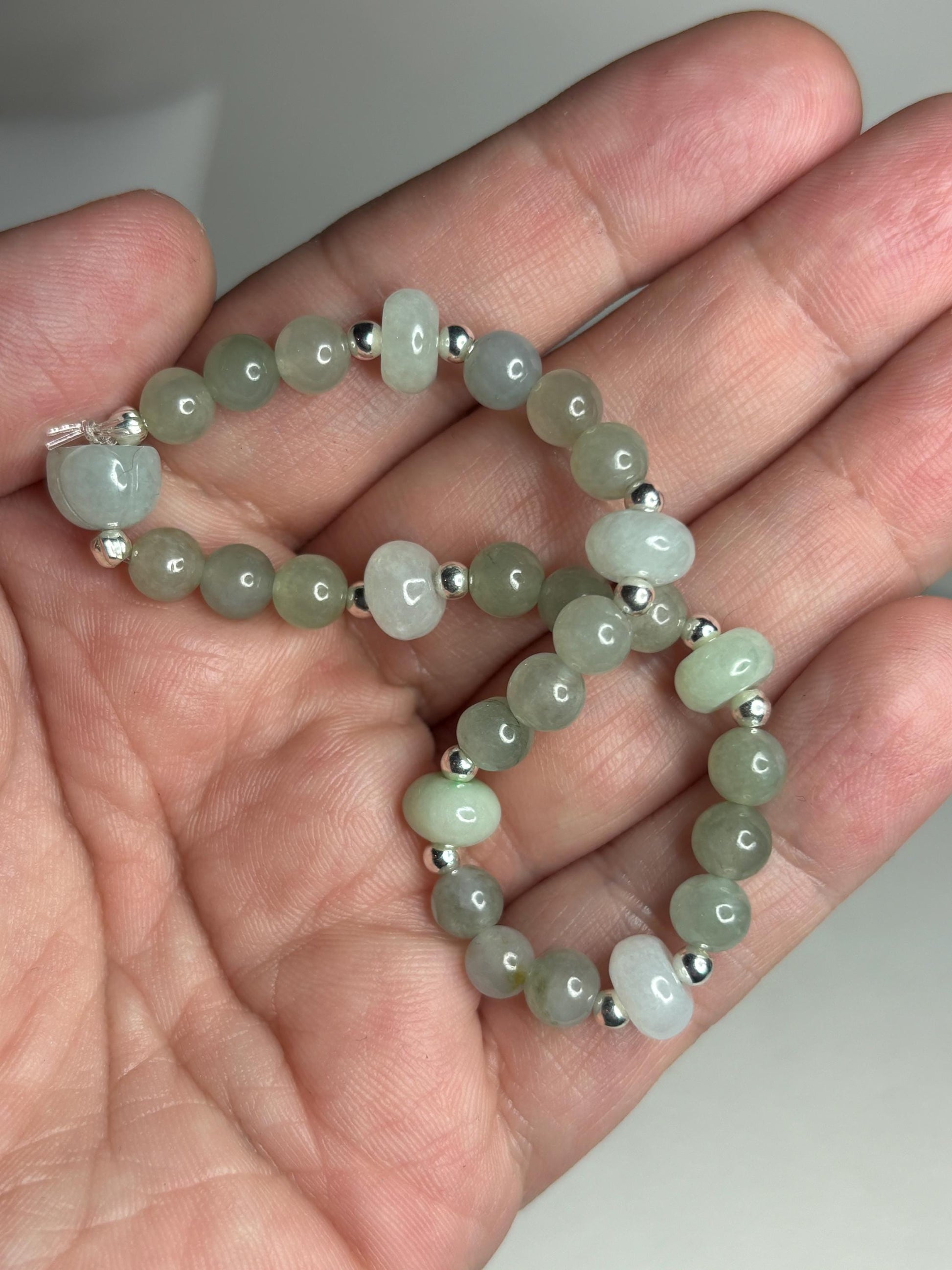 Natural Type A Icy Burmese Jadeite Jade Sterling Silver Stretch Bracelet with round and lotus bud beads.