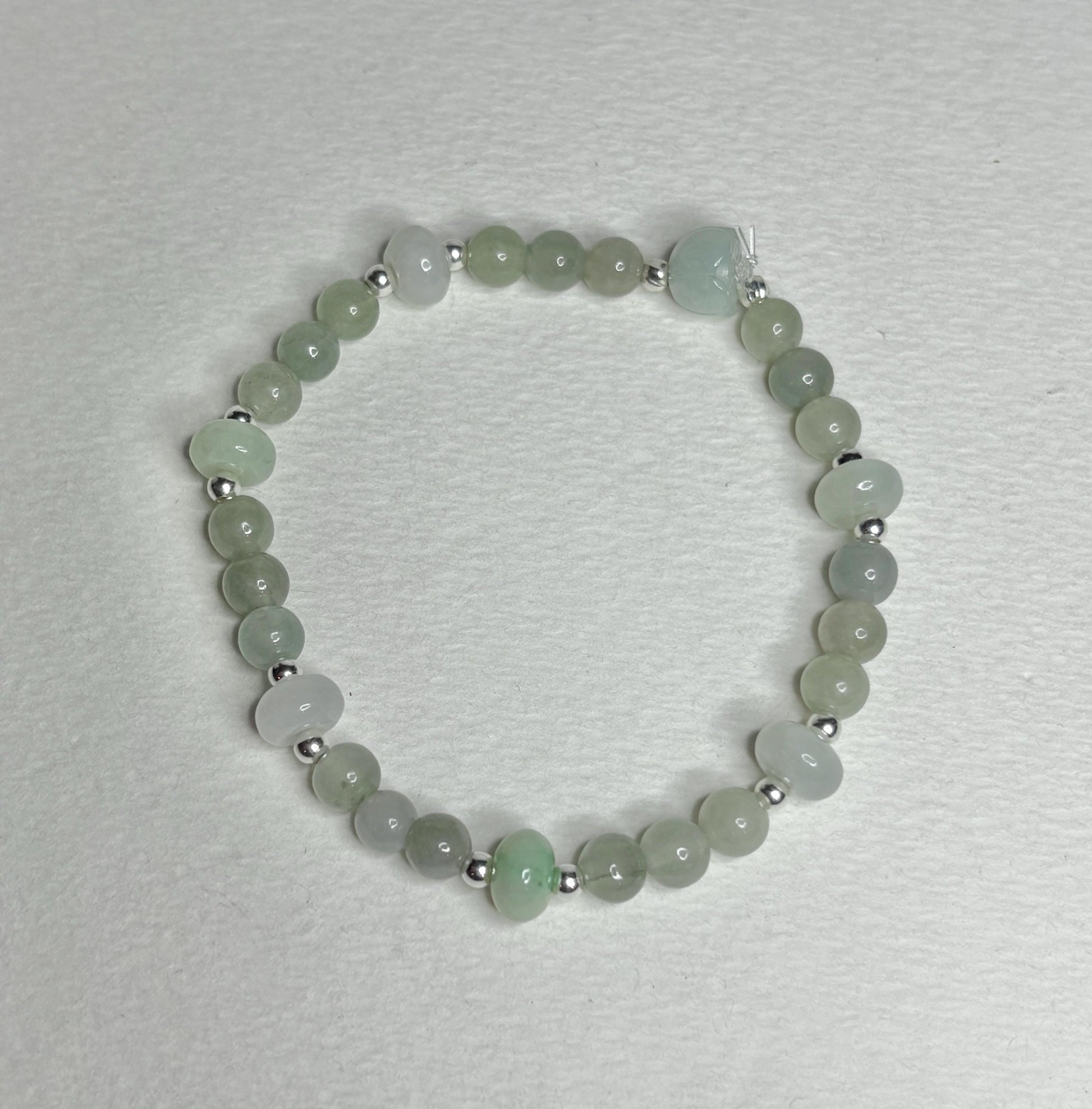 Natural Type A Icy Burmese Jadeite Jade Sterling Silver Stretch Bracelet with round and lotus bud beads.